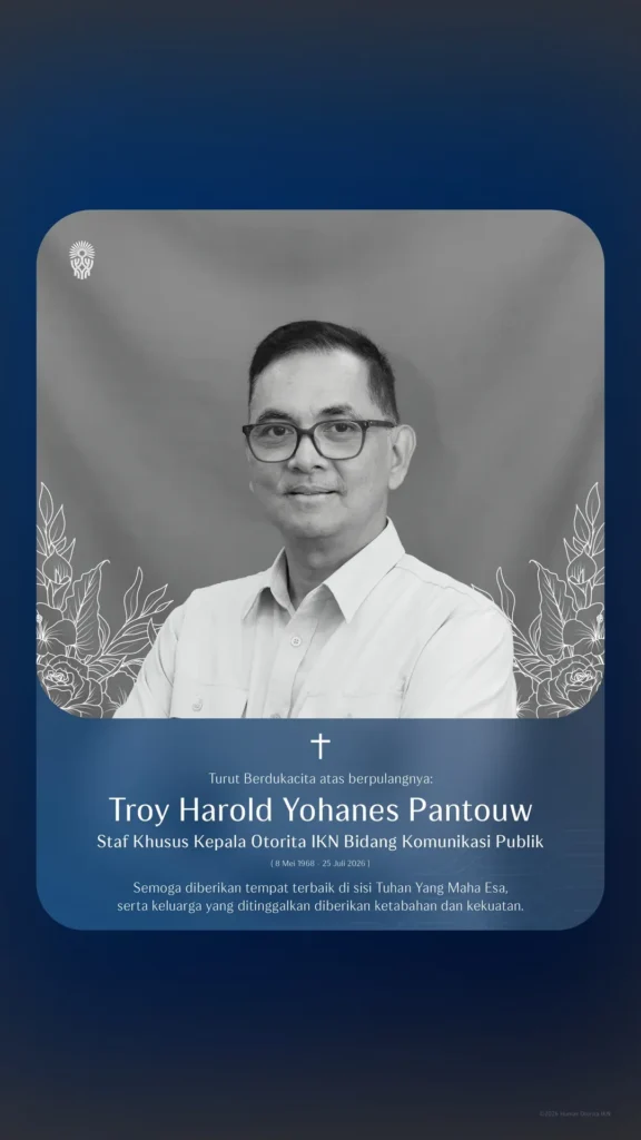 Memorial card featuring a grayscale portrait of troy harold yohanes pantouw with blue rounded frame floral accents and indonesian obituary text